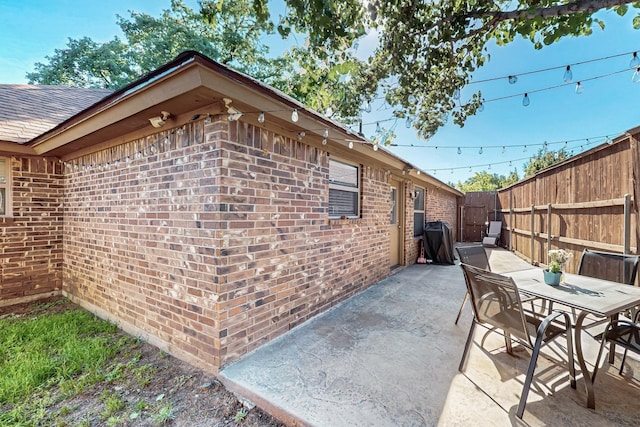 337 Grace Cir, Hurst, TX 76053 - fenced backyard featuring a patio area, outdoor dining area, and a grill