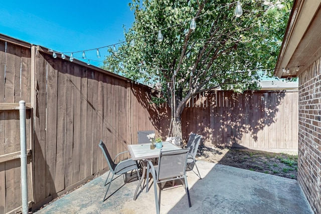 337 Grace Cir, Hurst, TX 76053 - fenced backyard with a patio and outdoor dining space