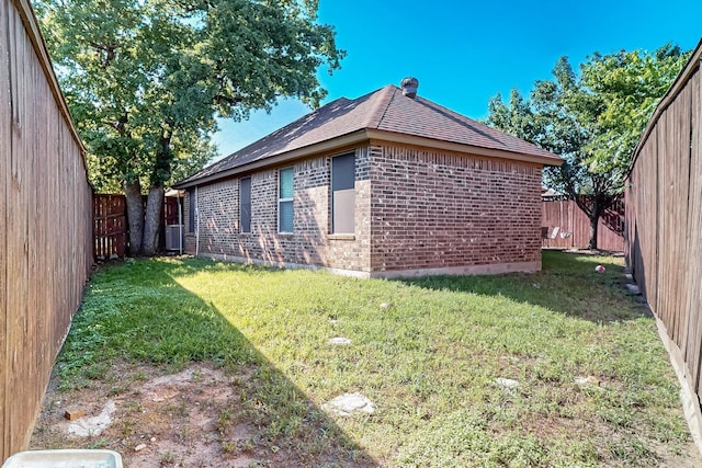 337 Grace Cir, Hurst, TX 76053 - view of home's exterior featuring brick siding, roof with shingles, and cooling unit