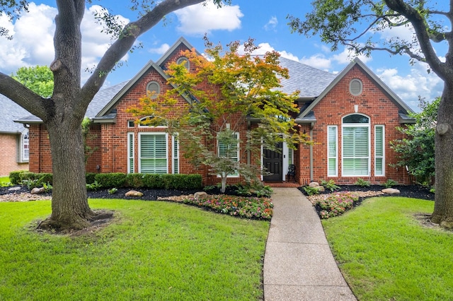 6717 Alcove Ln, Plano, TX 75024 - view of front of property featuring brick siding, a front lawn, and a shingled roof