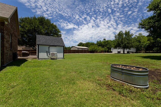 258 Pecan Hollow Cir, Anna, TX 75409 - view of yard featuring a storage unit