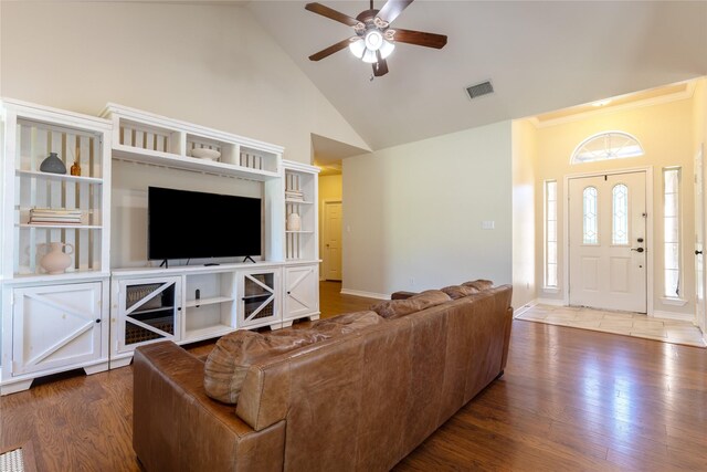 258 Pecan Hollow Cir, Anna, TX 75409 - living room featuring wood finished floors, a ceiling fan, high vaulted ceiling, and ornamental molding
