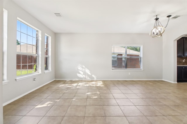 6321 Stone Lake Dr, Fort Worth, TX 76179 - unfurnished room featuring plenty of natural light, light tile patterned flooring, and baseboards