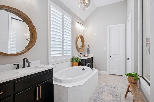 3228 Zenyatta Ct, Celina, TX 75009 - full bath with a garden tub, two vanities, vaulted ceiling, and a chandelier