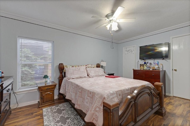 2044 Sherwood Dr, Garland, TX 75041 - bedroom featuring dark wood-type flooring, ornamental molding, baseboards, and ceiling fan