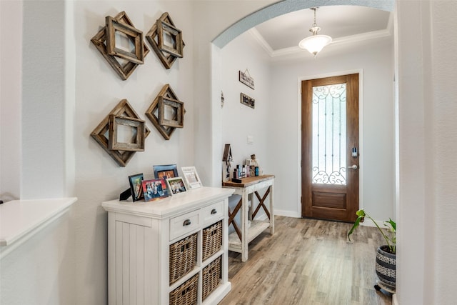 3118 Oak Crest Dr, Royse City, TX 75189 - entrance foyer with arched walkways, light wood finished floors, ornamental molding, and baseboards