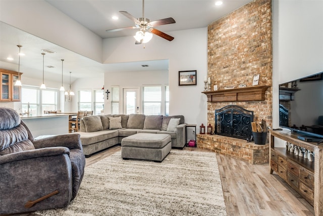 3118 Oak Crest Dr, Royse City, TX 75189 - living area featuring a ceiling fan, light wood-style floors, a fireplace, a towering ceiling, and recessed lighting