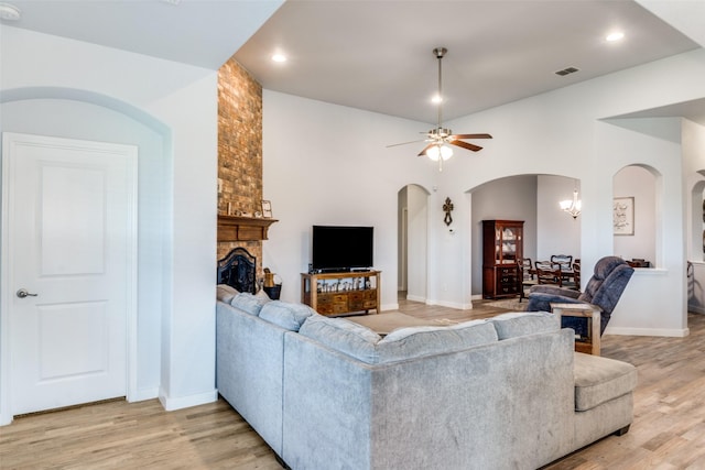 3118 Oak Crest Dr, Royse City, TX 75189 - living area with arched walkways, light wood-style floors, ceiling fan, baseboards, and recessed lighting