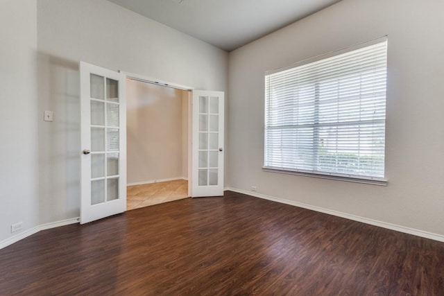 3820 Denridge Ln, Fort Worth, TX 76262 - spare room featuring french doors, wood finished floors, and baseboards