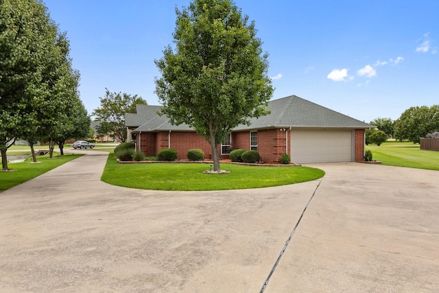 300 Burtonwood Cir, Ovilla, TX 75154 - view of front of property with driveway, a garage, brick siding, and a front yard