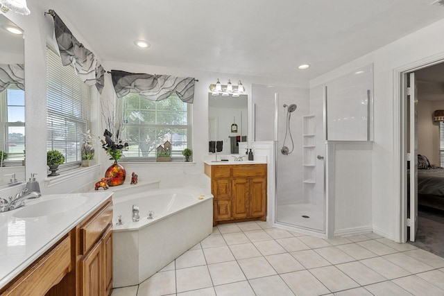 300 Burtonwood Cir, Ovilla, TX 75154 - bathroom featuring a walk in shower, two vanities, a bath, tile patterned floors, and ensuite bath