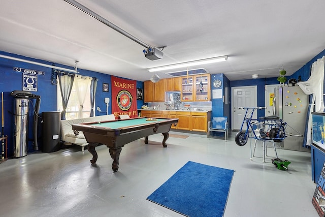 300 Burtonwood Cir, Ovilla, TX 75154 - playroom with billiards table, a garage, and concrete flooring