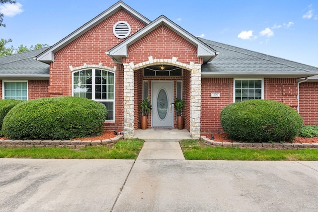 300 Burtonwood Cir, Ovilla, TX 75154 - view of front facade featuring brick siding and roof with shingles