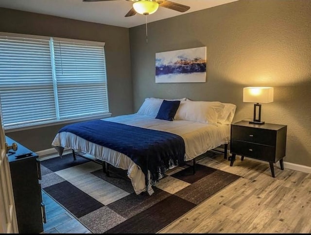 1432 Hurstview Dr, Hurst, TX 76053 - bedroom featuring wood finished floors, baseboards, and a ceiling fan