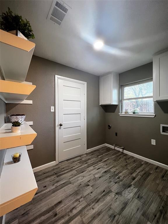 1432 Hurstview Dr, Hurst, TX 76053 - laundry room with dark wood-style flooring, baseboards, cabinet space, and hookup for a washing machine