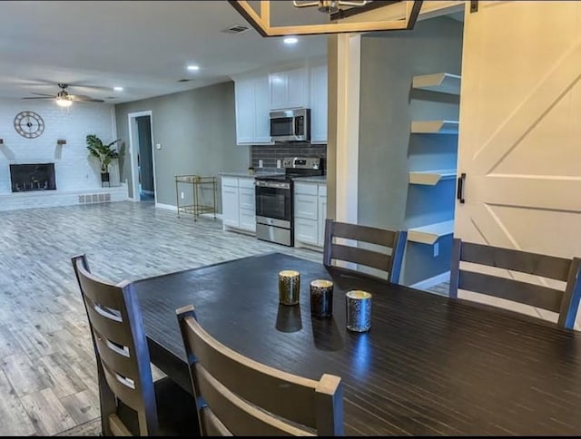 1432 Hurstview Dr, Hurst, TX 76053 - dining space featuring ceiling fan, baseboards, recessed lighting, and wood finished floors