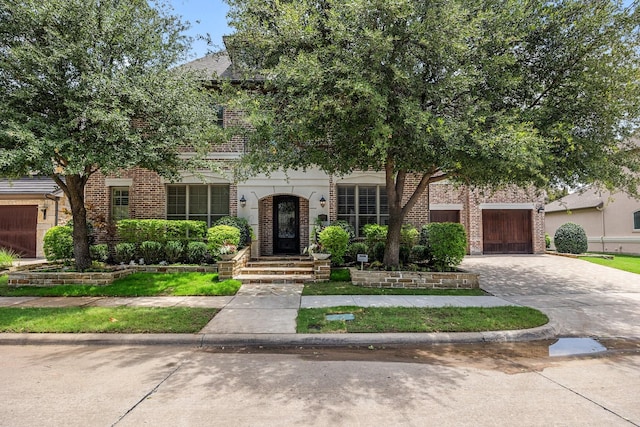 6208 Jacqueline Dr, Plano, TX 75024 - view of front facade featuring brick siding and driveway