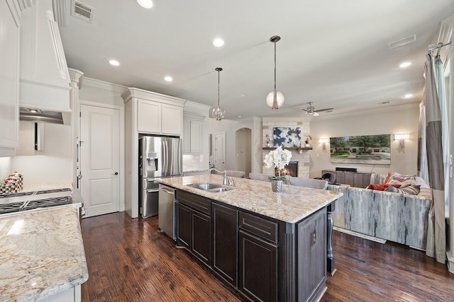6208 Jacqueline Dr, Plano, TX 75024 - kitchen featuring a sink, arched walkways, open floor plan, stainless steel appliances, and ceiling fan