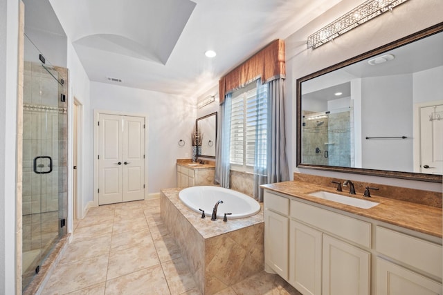 6208 Jacqueline Dr, Plano, TX 75024 - bathroom with a shower stall, two vanities, a bath, tile patterned flooring, and recessed lighting