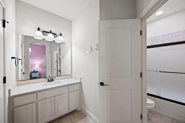 6208 Jacqueline Dr, Plano, TX 75024 - bathroom featuring vanity, toilet, shower / bath combination, tile patterned floors, and baseboards