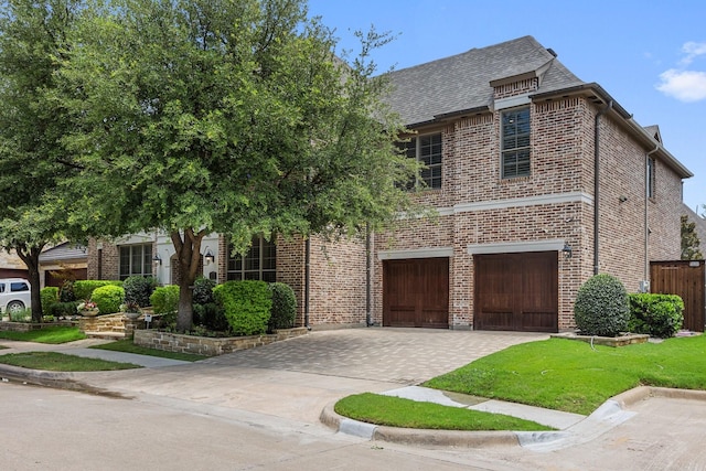 6208 Jacqueline Dr, Plano, TX 75024 - view of front of home featuring a garage, driveway, brick siding, and a shingled roof
