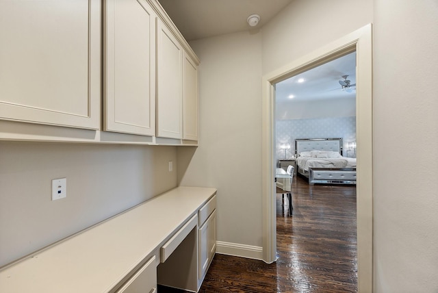 6208 Jacqueline Dr, Plano, TX 75024 - corridor with dark wood-type flooring and baseboards