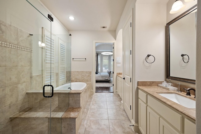 6208 Jacqueline Dr, Plano, TX 75024 - ensuite bathroom featuring a shower stall, vanity, a bath, and tile patterned flooring