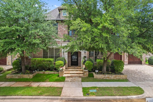 6208 Jacqueline Dr, Plano, TX 75024 - view of front facade with brick siding and driveway