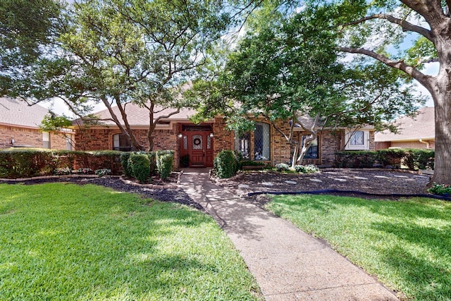 2521 La Vida Pl, Plano, TX 75023 - view of front of property with a front lawn and brick siding