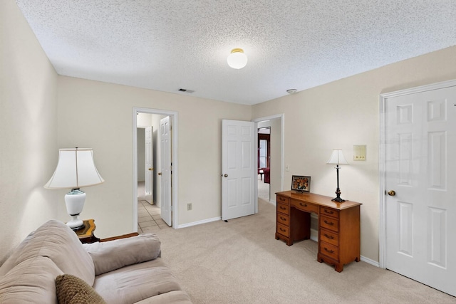 2521 La Vida Pl, Plano, TX 75023 - home office with light carpet, baseboards, and a textured ceiling