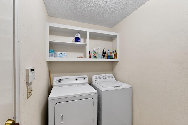 2521 La Vida Pl, Plano, TX 75023 - washroom with washing machine and dryer and a textured ceiling
