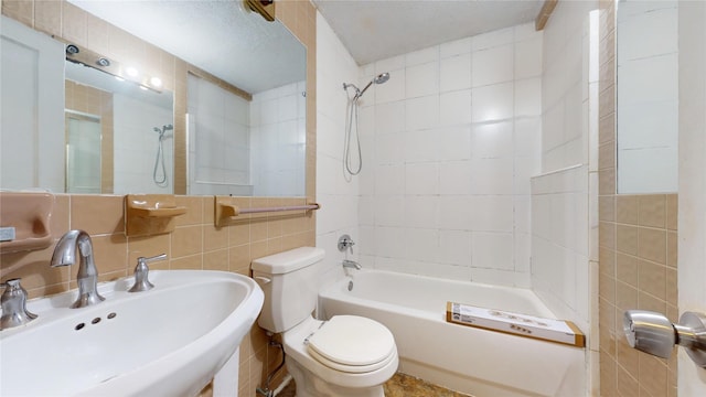 10502 Aledo Dr, Dallas, TX 75228 - full bath with a sink, tile walls, toilet, and shower / tub combination