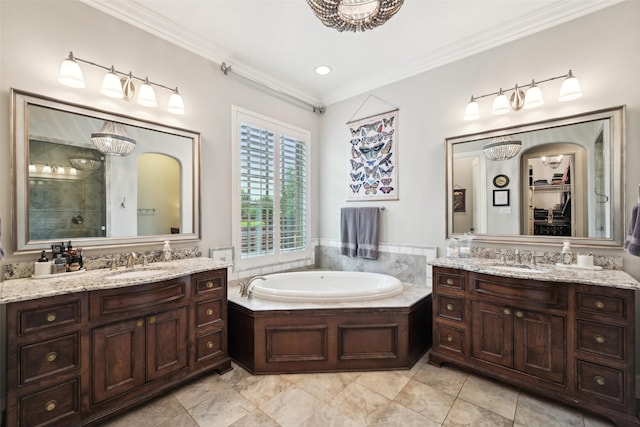 12669 Winding Hollow Ln, Frisco, TX 75033 - full bath featuring crown molding, two vanities, a bath, tiled shower, and tile patterned floors