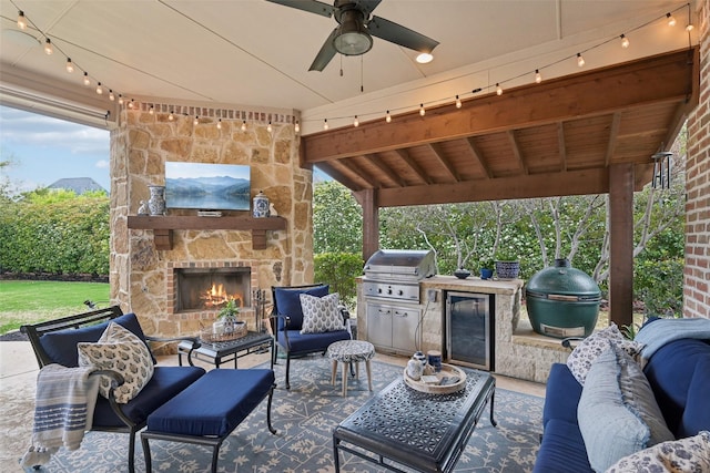 12669 Winding Hollow Ln, Frisco, TX 75033 - view of patio featuring an outdoor living space with a fireplace, wine cooler, and ceiling fan