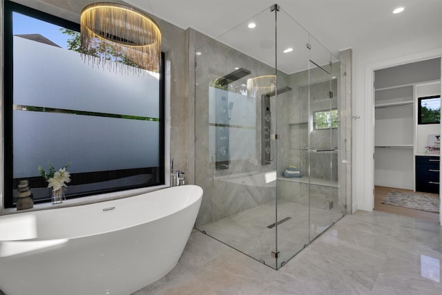 3932 Cortez Dr, Dallas, TX 75220 - bathroom with a freestanding tub, a stall shower, plenty of natural light, marble tiled flooring, and recessed lighting