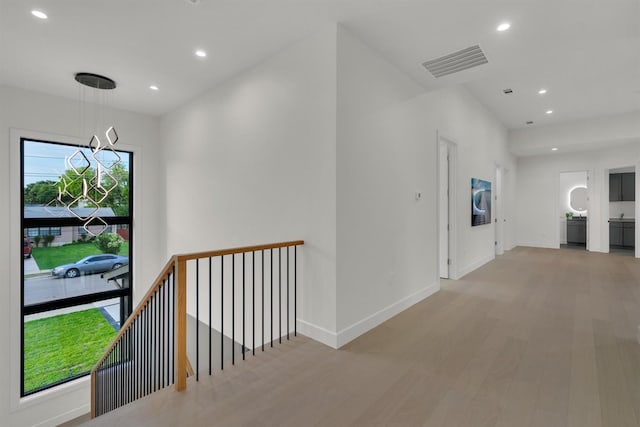 3932 Cortez Dr, Dallas, TX 75220 - hallway featuring recessed lighting, wood finished floors, baseboards, a chandelier, and an upstairs landing