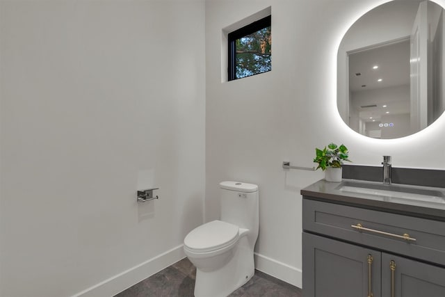 3932 Cortez Dr, Dallas, TX 75220 - bathroom with baseboards, vanity, and toilet