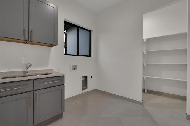 3932 Cortez Dr, Dallas, TX 75220 - laundry room with electric dryer hookup, cabinet space, washer hookup, and baseboards