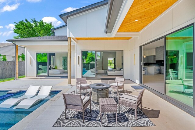 3932 Cortez Dr, Dallas, TX 75220 - view of patio featuring an outdoor living space with a fire pit, a sink, and a hot tub