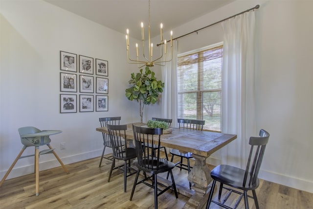 550 Capstone Ridge Dr, Santo, TX 76472 - dining space featuring a chandelier, baseboards, and light wood-type flooring