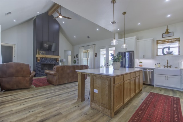550 Capstone Ridge Dr, Santo, TX 76472 - kitchen with appliances with stainless steel finishes, open floor plan, a sink, beamed ceiling, and high vaulted ceiling