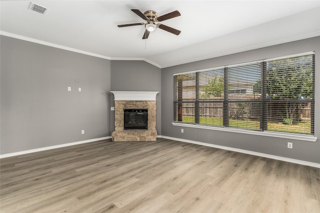 7500 Archer Way, Mckinney, TX 75072 - unfurnished living room with crown molding, a ceiling fan, a fireplace, baseboards, and wood finished floors