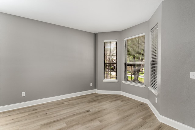 7500 Archer Way, Mckinney, TX 75072 - unfurnished room with light wood finished floors and baseboards
