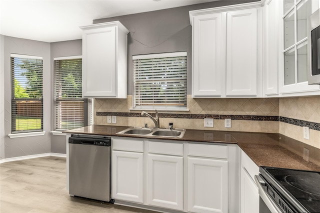 7500 Archer Way, Mckinney, TX 75072 - kitchen with stainless steel dishwasher, a sink, white cabinetry, and dark countertops