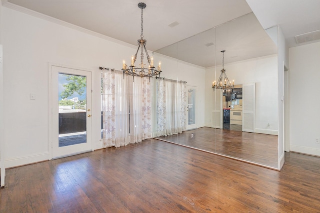 10416 High Hollows Dr Unit 232, Dallas, TX 75230 - unfurnished dining area with a chandelier, wood finished floors, baseboards, and ornamental molding