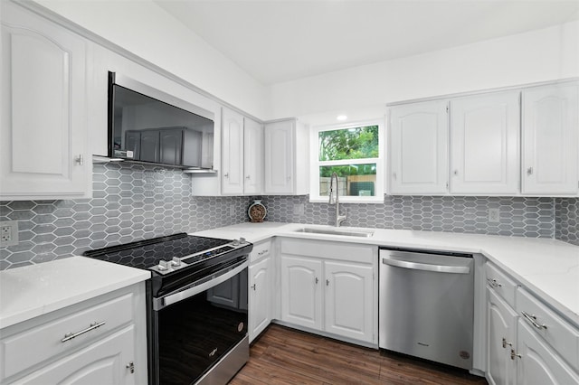 2428 Meadow Crk, Bedford, TX 76021 - kitchen featuring stainless steel appliances, tasteful backsplash, and white cabinets