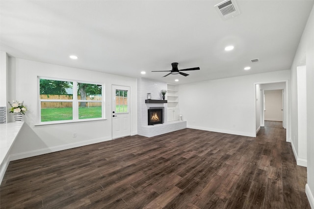 2428 Meadow Crk, Bedford, TX 76021 - unfurnished living room featuring dark wood-type flooring, ceiling fan, a fireplace, and recessed lighting