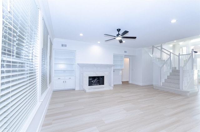 1106 Timbercreek Dr, Allen, TX 75002 - unfurnished living room featuring stairs, ceiling fan, recessed lighting, a premium fireplace, and ornamental molding