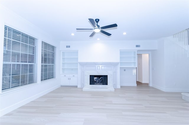 1106 Timbercreek Dr, Allen, TX 75002 - unfurnished living room with ceiling fan, light wood finished floors, ornamental molding, a premium fireplace, and recessed lighting
