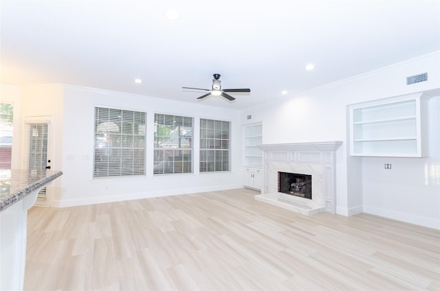1106 Timbercreek Dr, Allen, TX 75002 - unfurnished living room with ceiling fan, crown molding, plenty of natural light, light wood-style floors, and recessed lighting